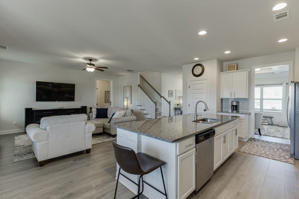 558 Calgary Downs Drive Winder, GA 30680 - Photo 12 of 50 a kitchen with counter top space and a sink
