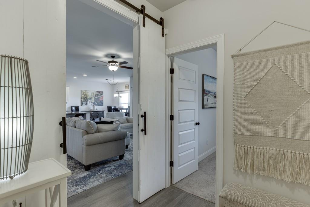 558 Calgary Downs Drive Winder, GA 30680 - Photo 25 of 50 a view of a livingroom with furniture and windows