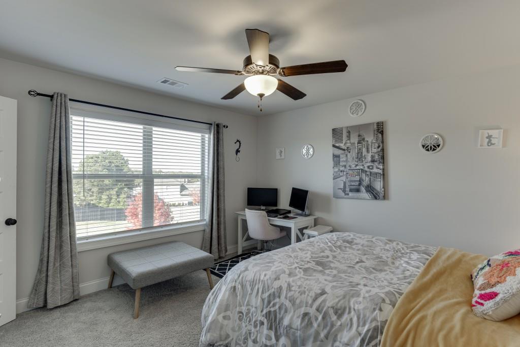 558 Calgary Downs Drive Winder, GA 30680 - Photo 26 of 50 a bedroom that has a bed and a window
