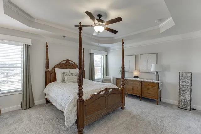 a bedroom with bed and window