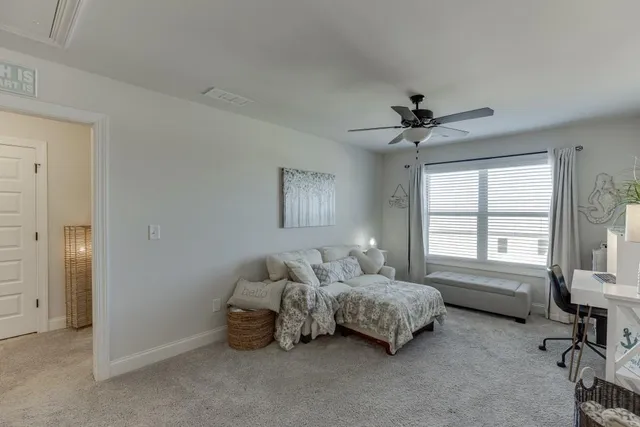 a bedroom with bed and a window