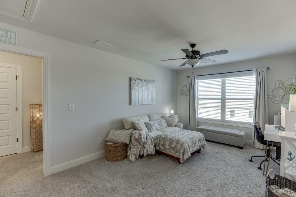 558 Calgary Downs Drive Winder, GA 30680 - Photo 36 of 50 a bedroom with bed and a window