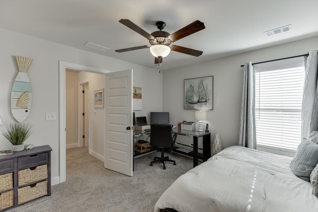 558 Calgary Downs Drive Winder, GA 30680 - Photo 39 of 50 a work room with bed and a window