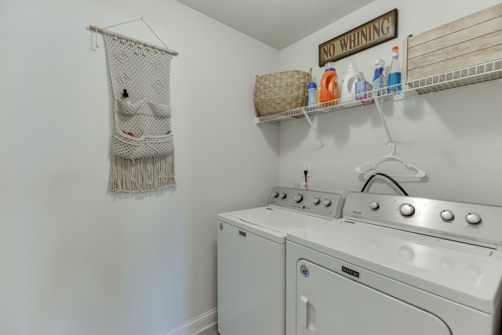 558 Calgary Downs Drive Winder, GA 30680 - Photo 41 of 50 a utility room with dryer and washer