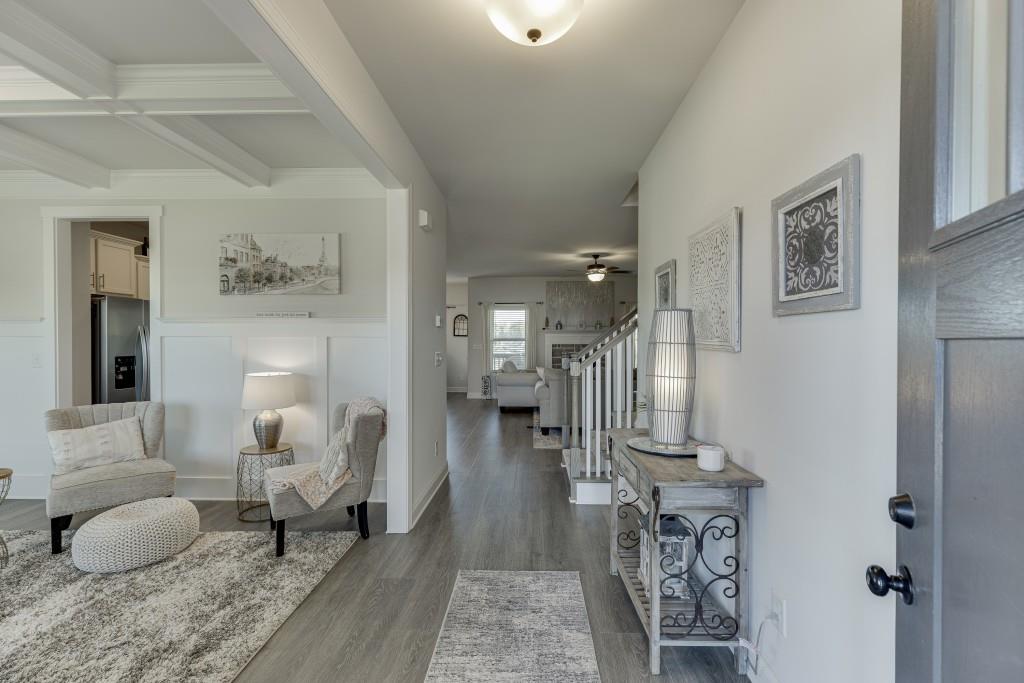 558 Calgary Downs Drive Winder, GA 30680 - Photo 8 of 50 a living room with furniture and a wooden floor