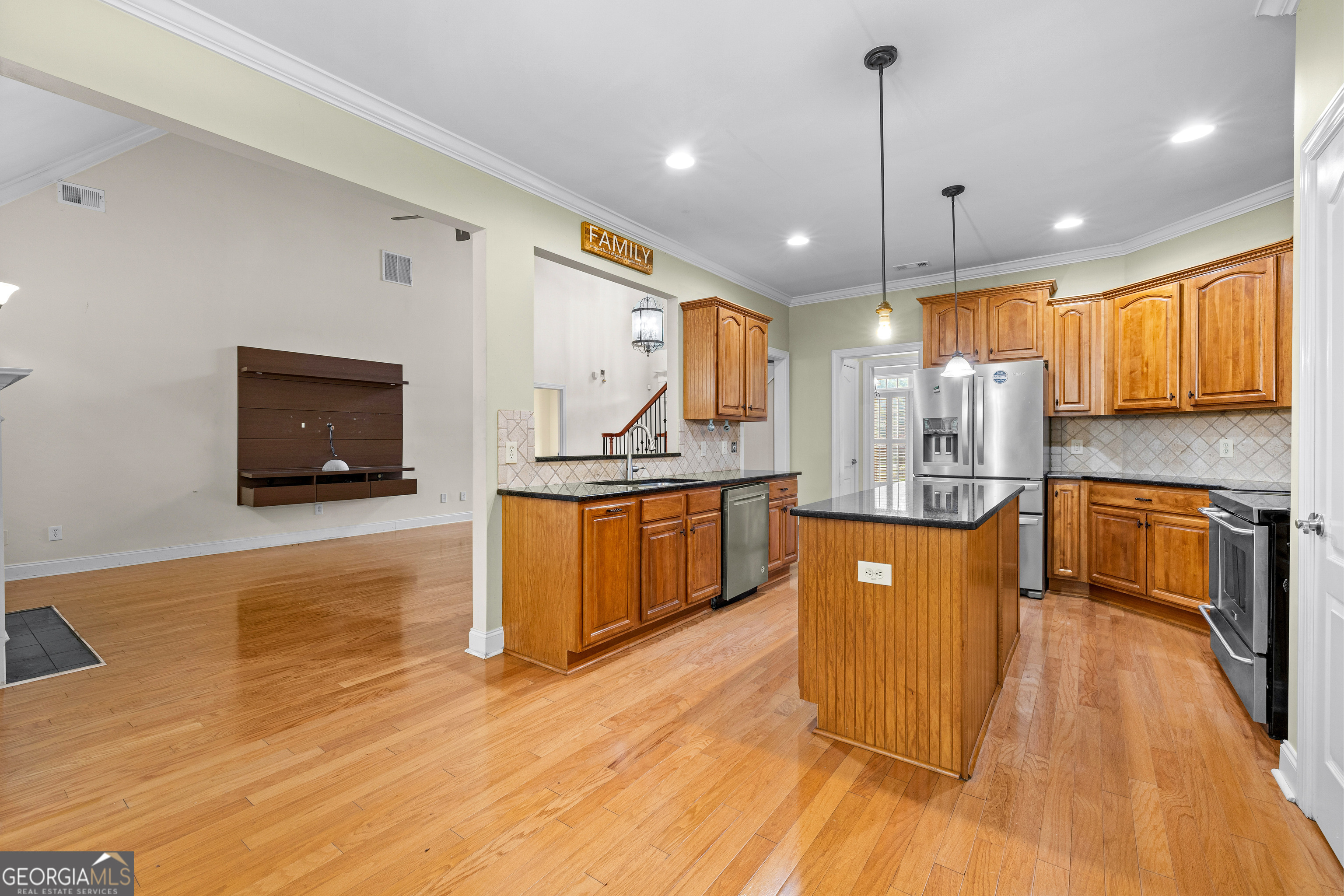 120 Shankhill Ridge Tyrone, GA 30290 - Photo 11 of 54 a kitchen with stainless steel appliances granite countertop a sink a stove top oven a counter space and cabinets