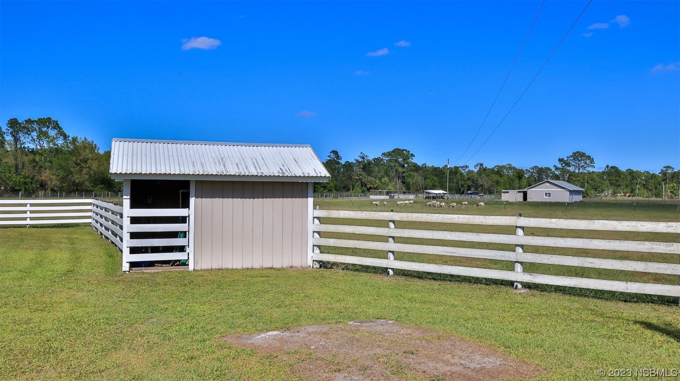677 State Rte 415 New Smyrna Beach, FL 32168 - Photo 12 of 74 a view of outdoor space and deck
