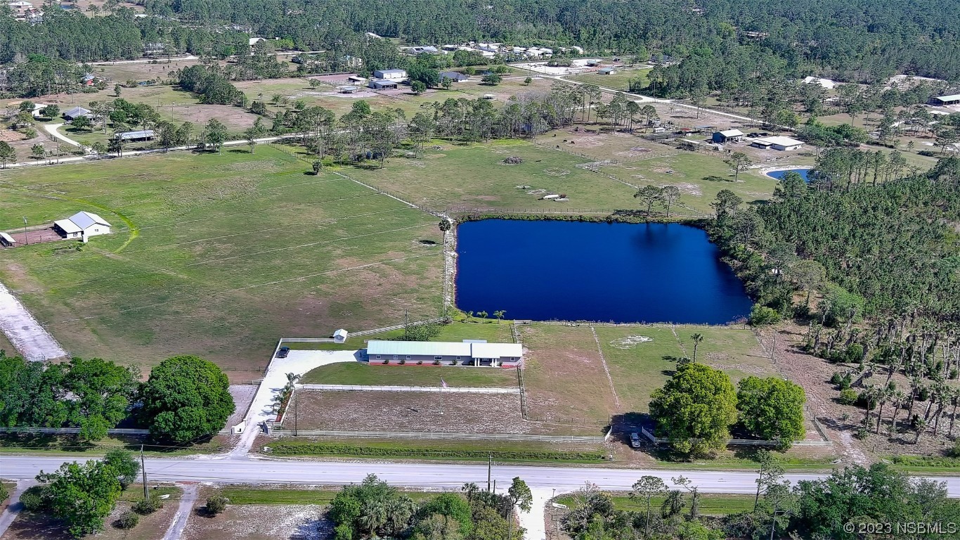 677 State Rte 415 New Smyrna Beach, FL 32168 - Photo 16 of 74 an aerial view of residential houses with outdoor space and swimming pool