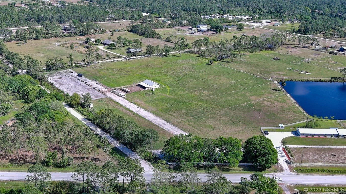677 State Rte 415 New Smyrna Beach, FL 32168 - Photo 17 of 74 an aerial view of a houses with outdoor space and street view