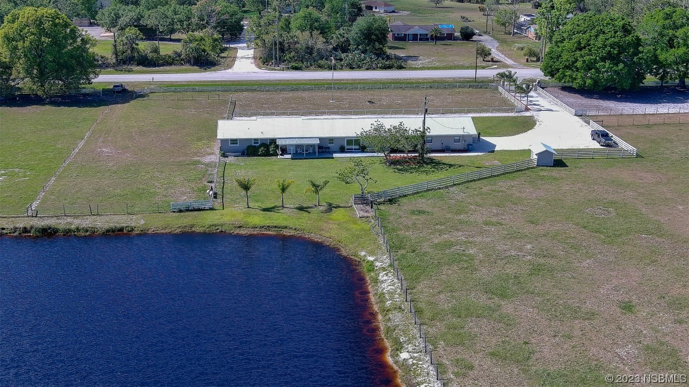 677 State Rte 415 New Smyrna Beach, FL 32168 - Photo 20 of 74 a view of a back yard of the house