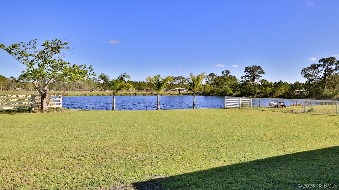 677 State Rte 415 New Smyrna Beach, FL 32168 - Photo 2 of 74 a view of an outdoor space and swimming pool