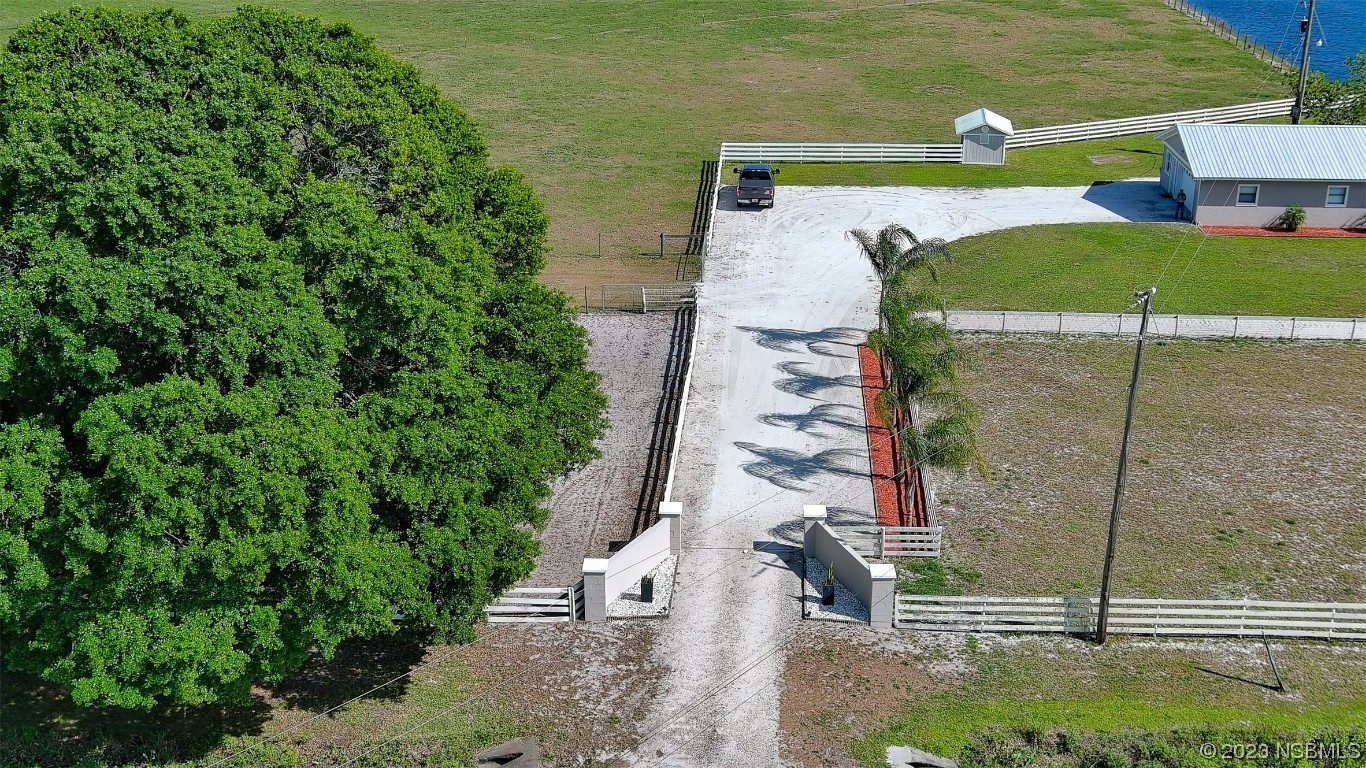 677 State Rte 415 New Smyrna Beach, FL 32168 - Photo 24 of 74 a balcony view with a garden space