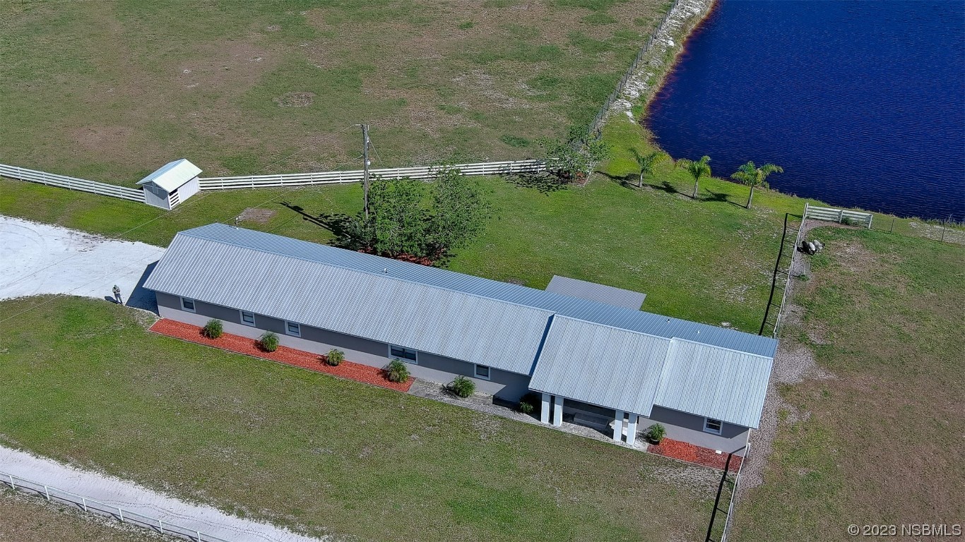 677 State Rte 415 New Smyrna Beach, FL 32168 - Photo 26 of 74 a view of a backyard with plants