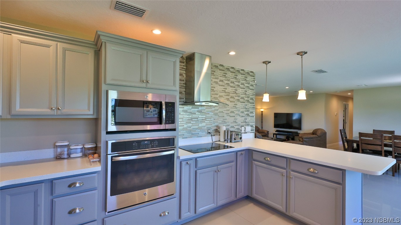 677 State Rte 415 New Smyrna Beach, FL 32168 - Photo 30 of 74 a kitchen with a sink and cabinets