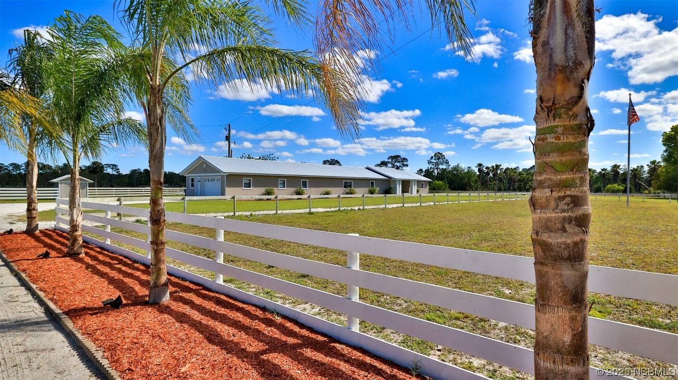 677 State Rte 415 New Smyrna Beach, FL 32168 - Photo 4 of 74 a view of a swimming pool with a table and chairs