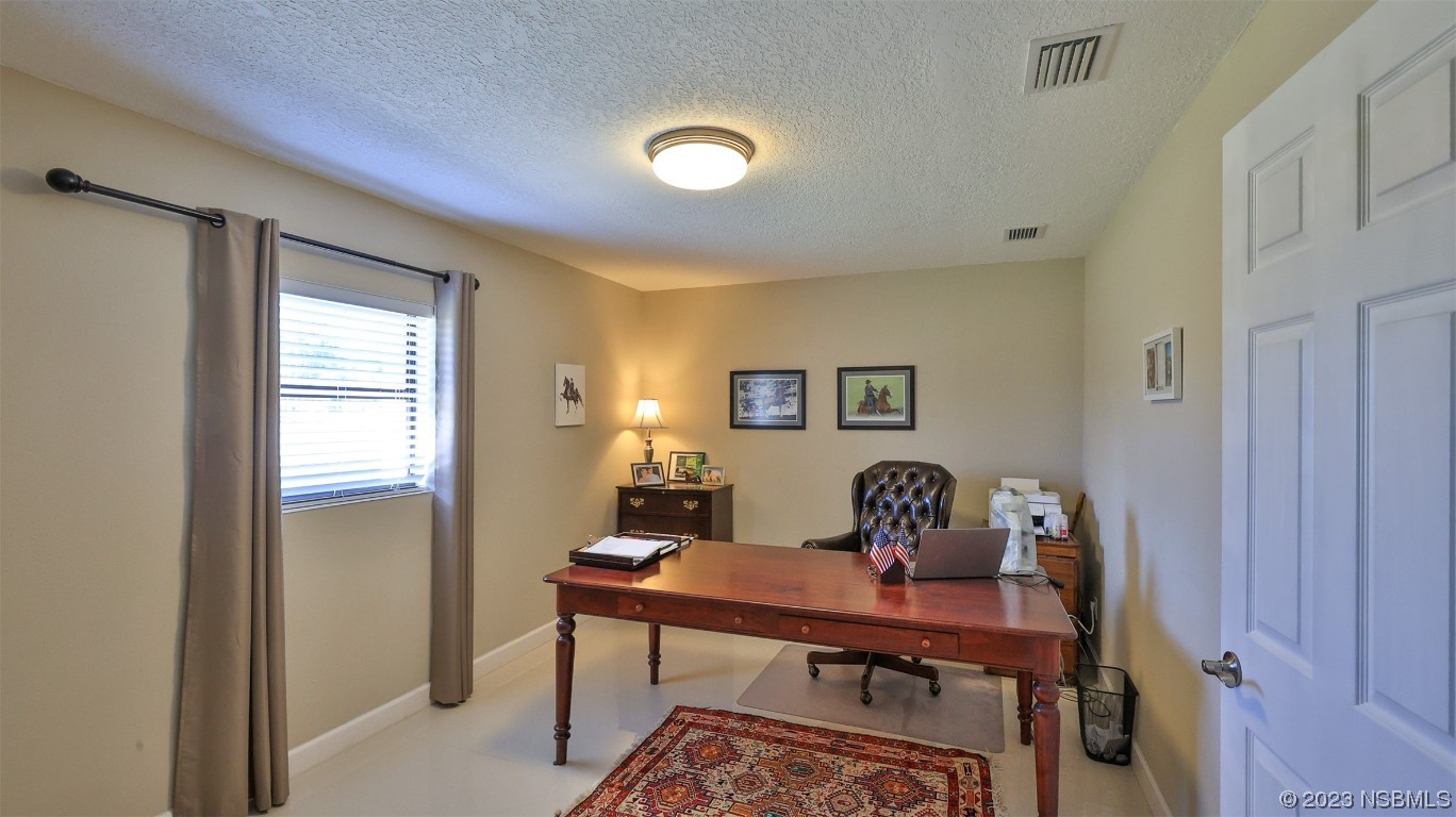 677 State Rte 415 New Smyrna Beach, FL 32168 - Photo 45 of 74 a view of a workspace with a window