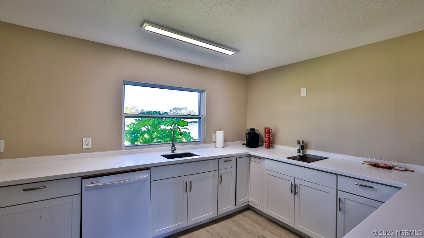 677 State Rte 415 New Smyrna Beach, FL 32168 - Photo 51 of 74 a kitchen with a sink and a window
