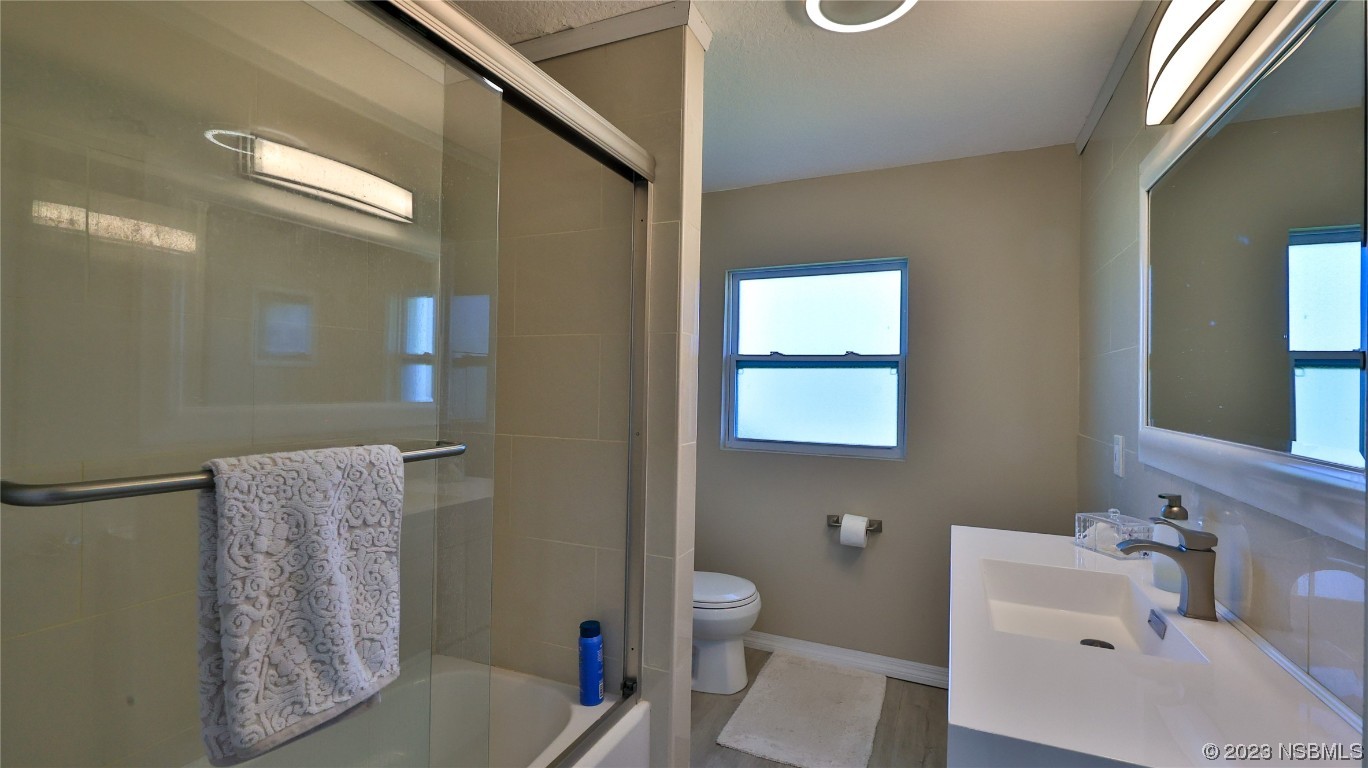 677 State Rte 415 New Smyrna Beach, FL 32168 - Photo 55 of 74 a bathroom with a sink toilet and shower