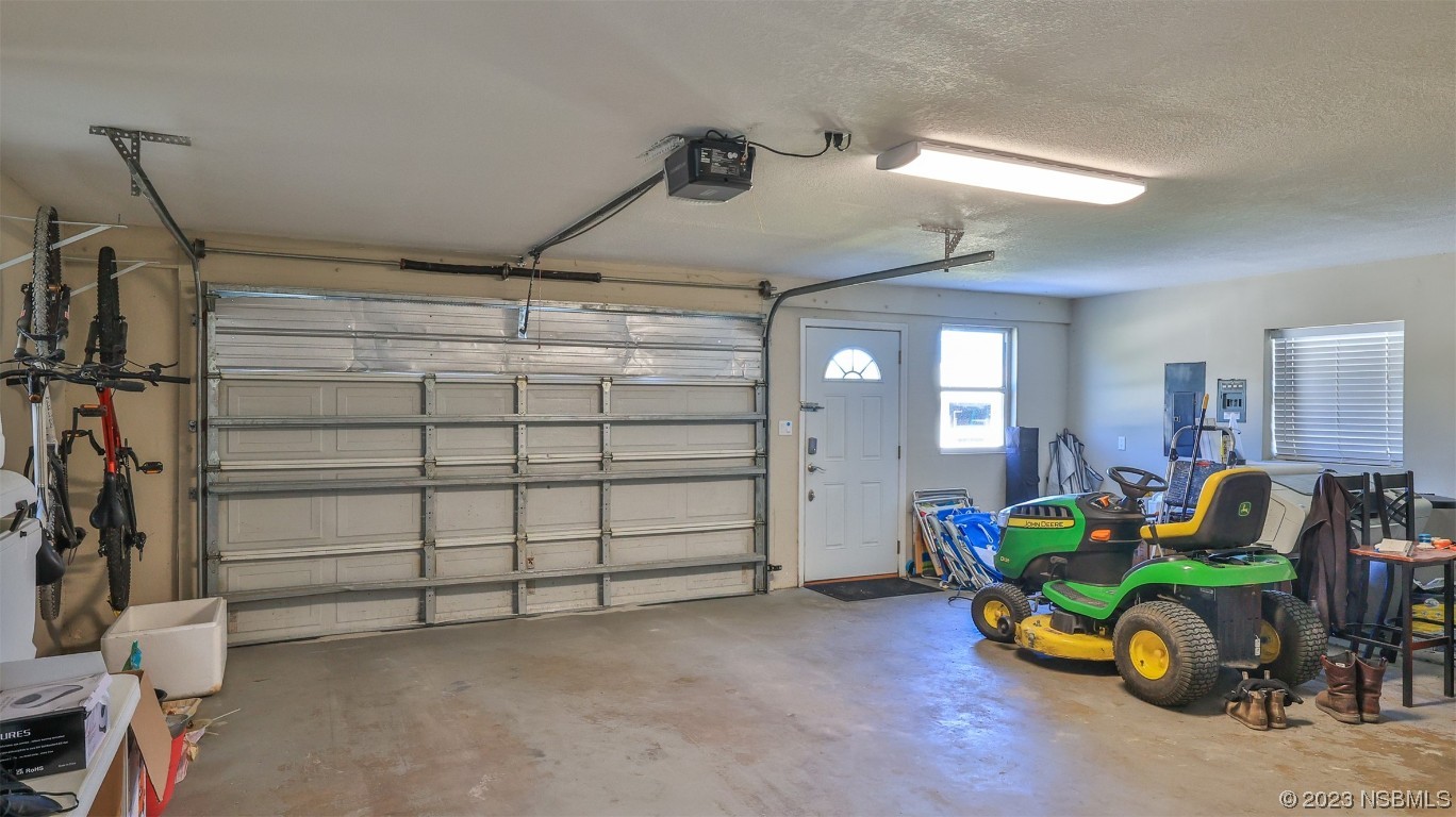 677 State Rte 415 New Smyrna Beach, FL 32168 - Photo 58 of 74 a bedroom with furniture and a window