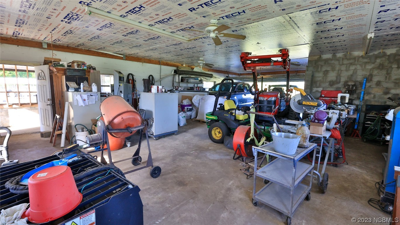 677 State Rte 415 New Smyrna Beach, FL 32168 - Photo 63 of 74 a view of a storage room with racks