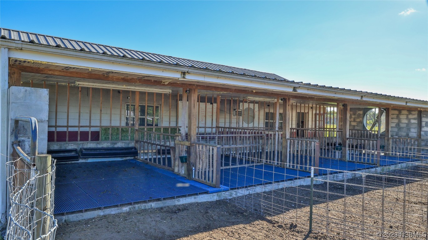 677 State Rte 415 New Smyrna Beach, FL 32168 - Photo 69 of 74 a view of front door and porch