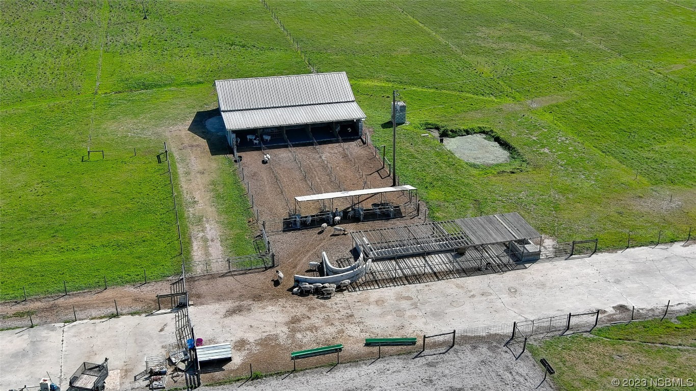 677 State Rte 415 New Smyrna Beach, FL 32168 - Photo 72 of 74 an aerial view of a house with a yard