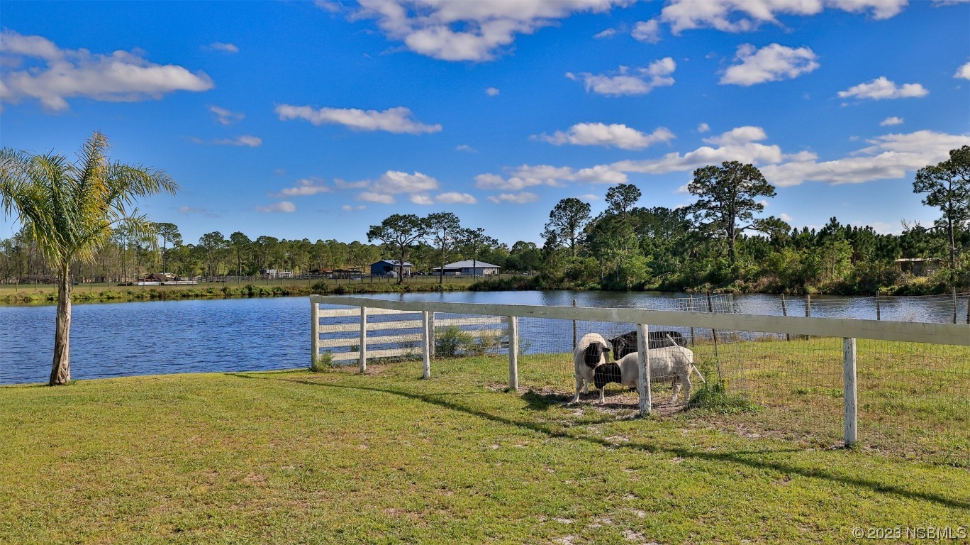 677 State Rte 415 New Smyrna Beach, FL 32168 - Photo 10 of 74 a view of a lake in middle of the house
