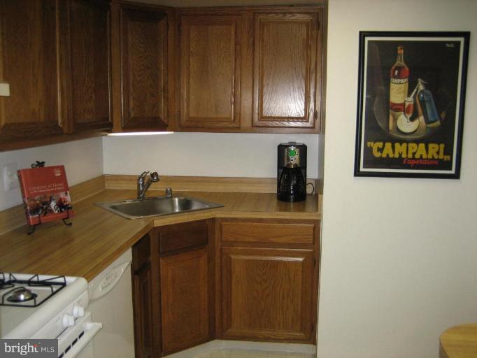 1533 Northgate Square, Unit 33/1A Reston, VA 20190 - Photo 5 of 6 a kitchen with a sink and cabinets