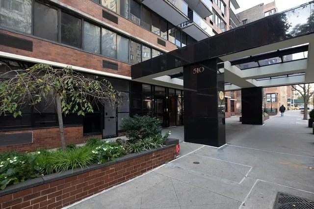 a view of a large building from a balcony