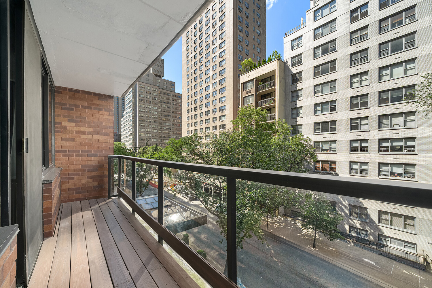 510 East 80th Street, Unit 4F Manhattan, NY 10075 - Photo 6 of 15 a view of a balcony with wooden floor