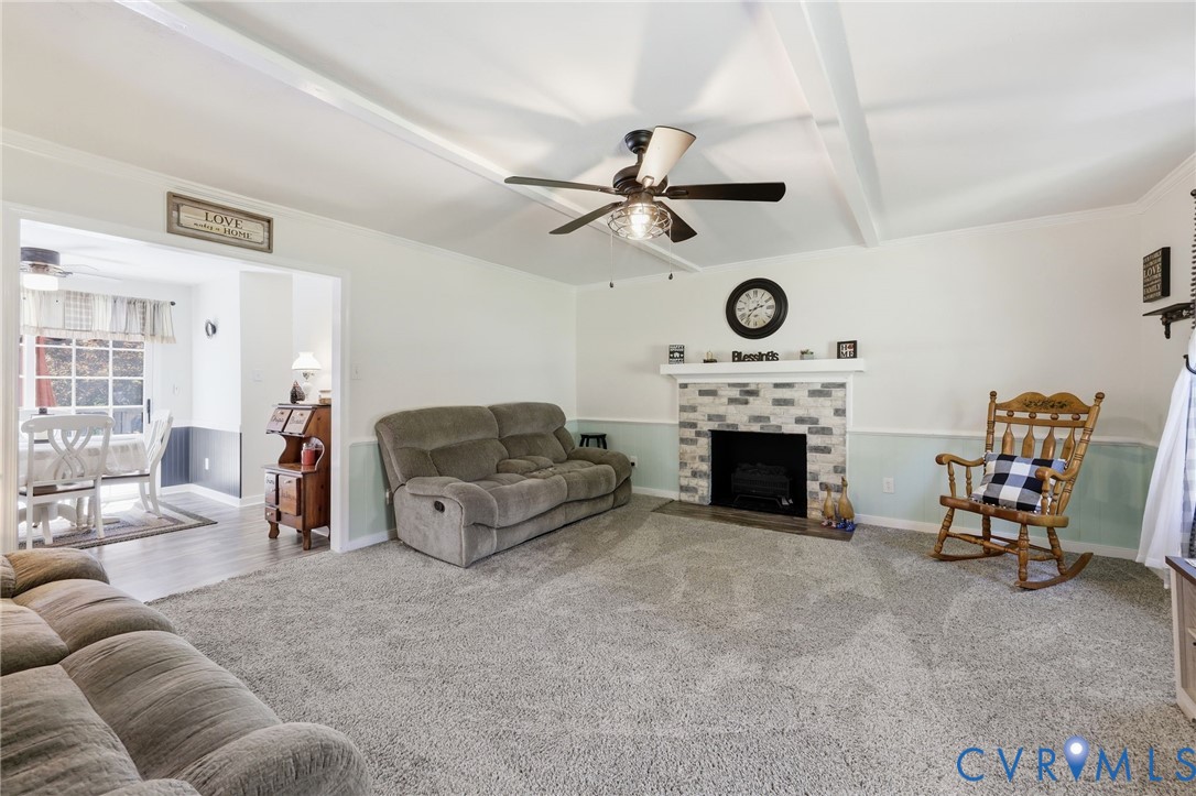 11200 Surry Road Chester, VA 23831 - Photo 8 of 48 a living room with furniture and a fireplace