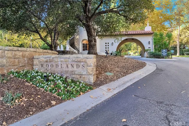 a spacious bathroom with a granite countertop sink and a mirror