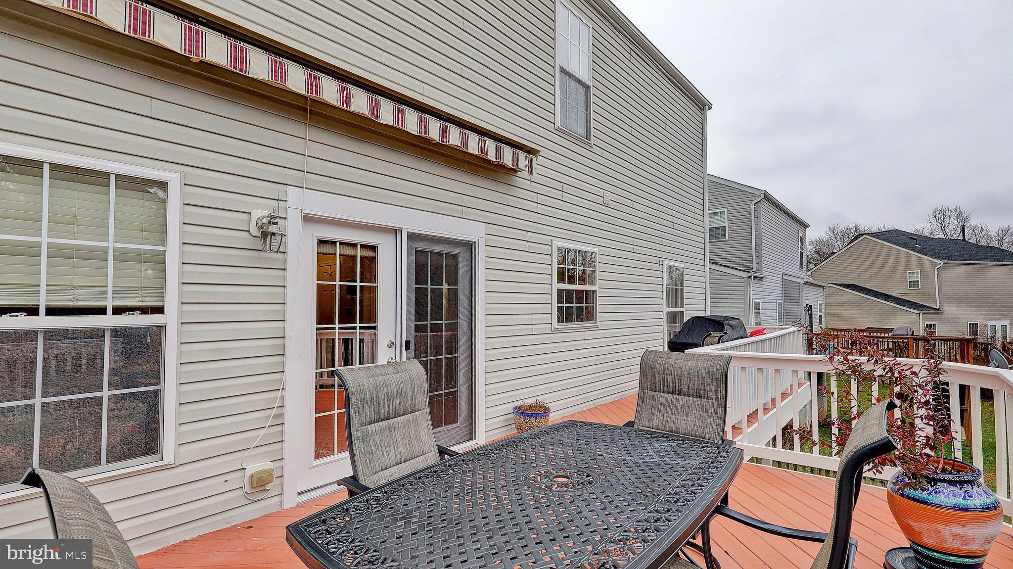 14641 Red House Road Gainesville, VA 20155 - Photo 8 of 44 Sun Setter awning over deck conveys