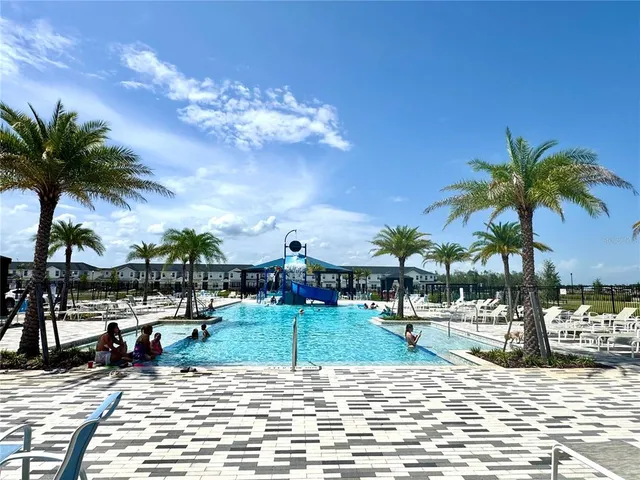 a view of swimming pool with a patio