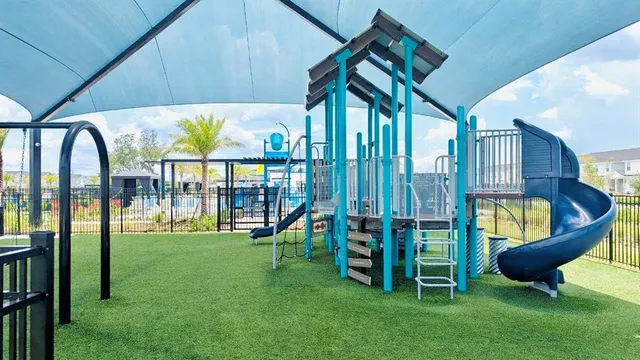 a view of kitchen with wooden floor and stainless steel appliances