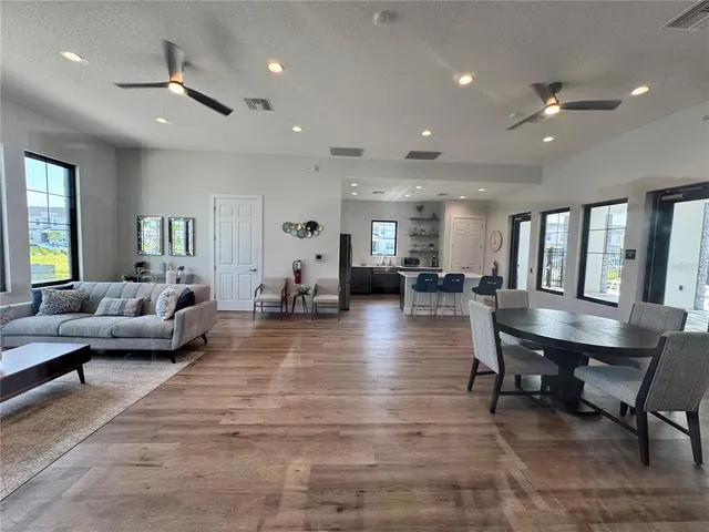 a outdoor view of a patio with a table and chairs
