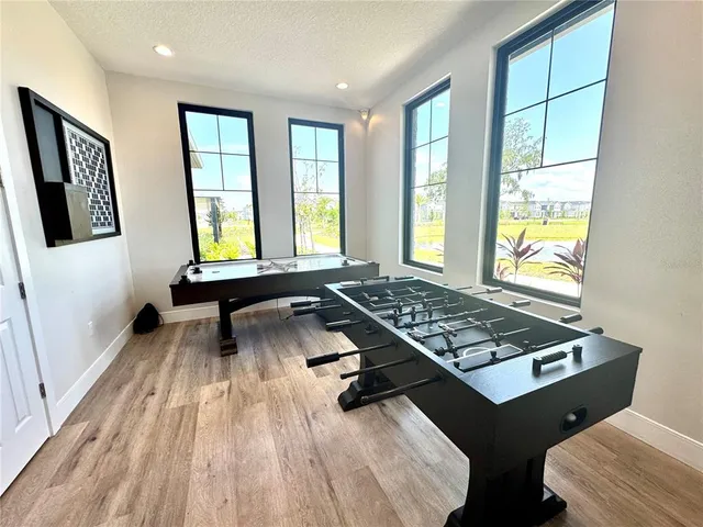 a view of a porch with couches table and chairs