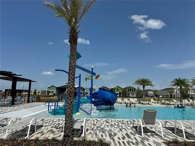 a view of a yard with furniture and outdoor seating