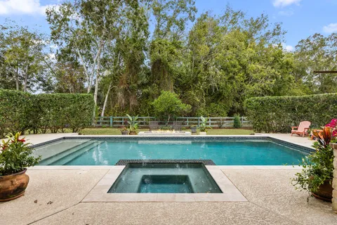 a view of swimming pool with seating space