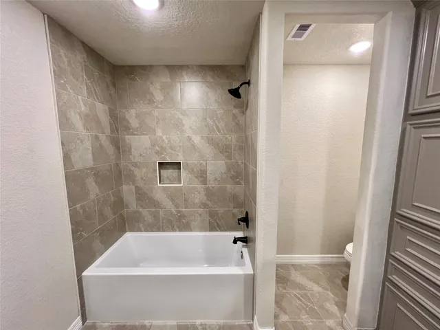 a bathroom with a bathtub