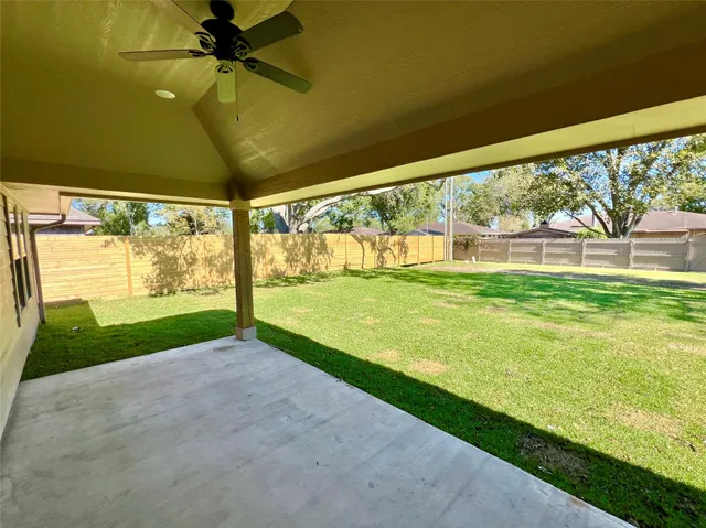 a view of yard with porch and a yard