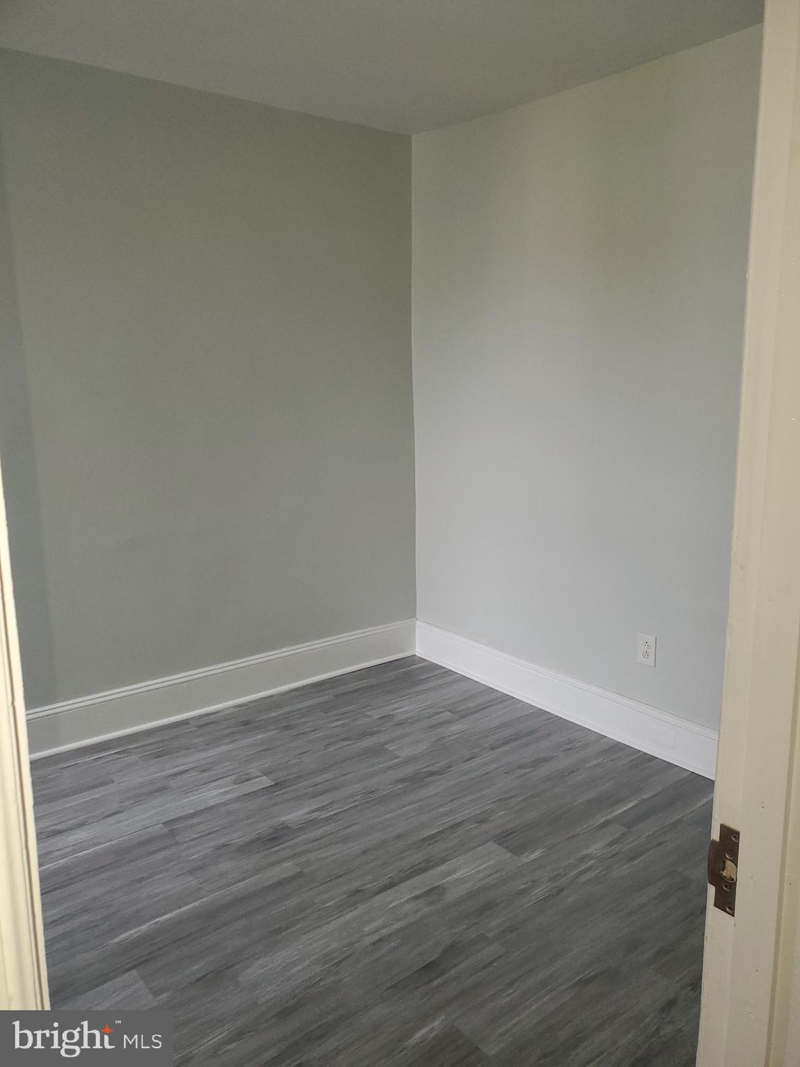 3050 Memphis Street Philadelphia, PA 19134 - Photo 14 of 20 a view of an empty room with wooden floor
