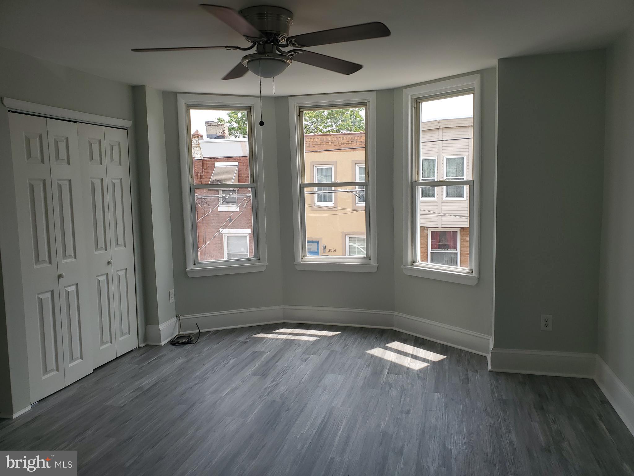 3050 Memphis Street Philadelphia, PA 19134 - Photo 15 of 20 an empty room with wooden floor and windows