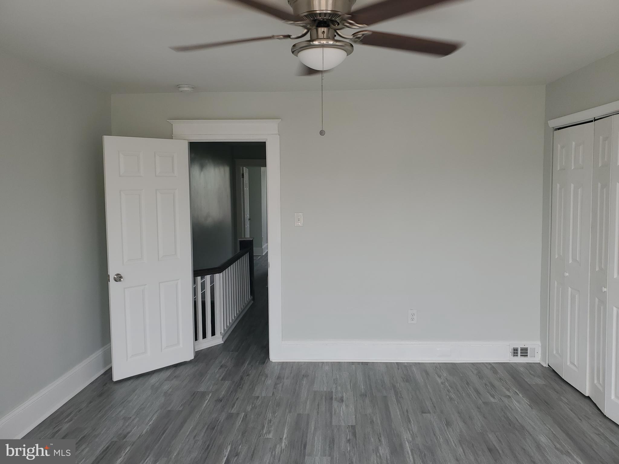 3050 Memphis Street Philadelphia, PA 19134 - Photo 17 of 20 a view of a room with wooden floor and a ceiling fan