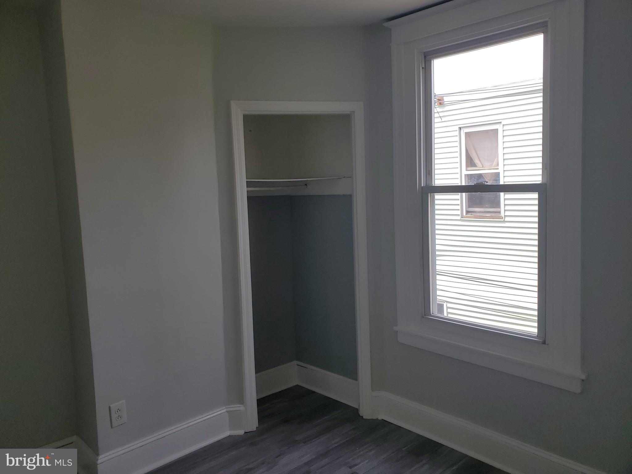 3050 Memphis Street Philadelphia, PA 19134 - Photo 5 of 20 a view of an empty room with wooden floor and a window
