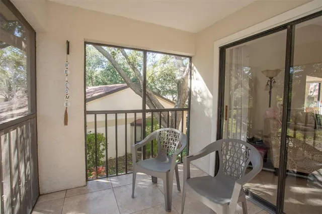 a view of a balcony with chairs