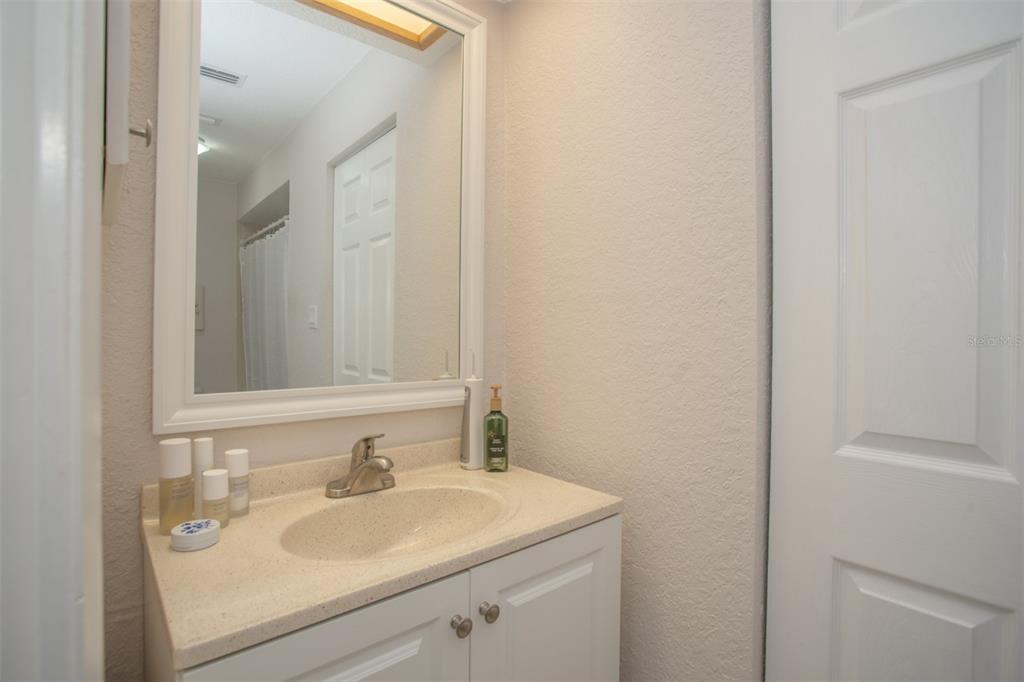 11511 113th Street, Unit 13H Largo, FL 33778 - Photo 15 of 28 a bathroom with a sink and a mirror