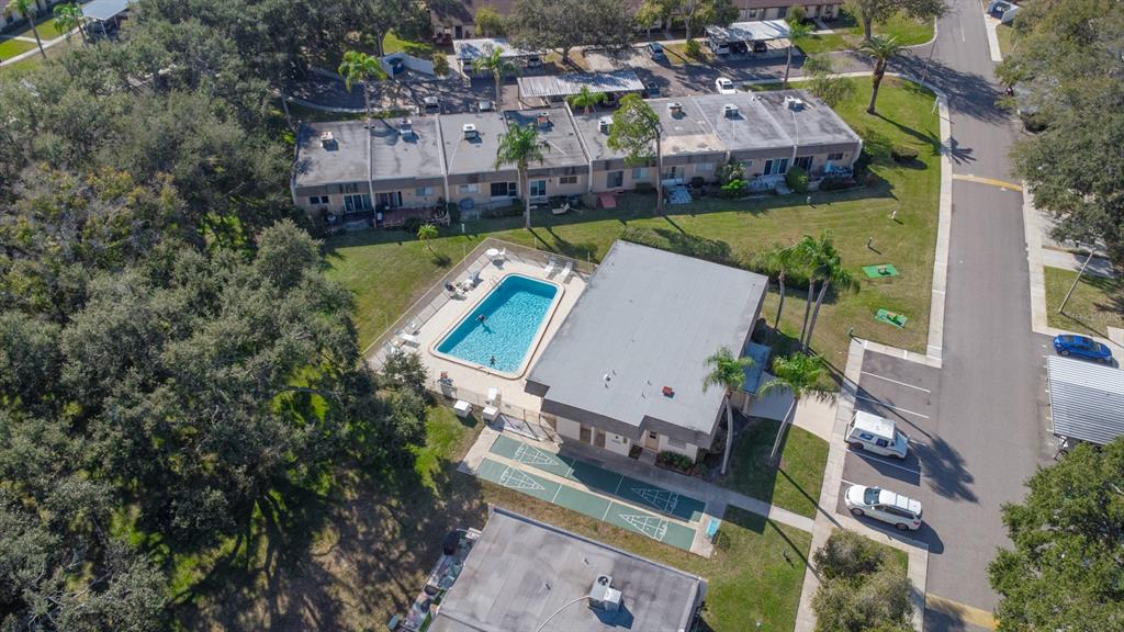 11511 113th Street, Unit 13H Largo, FL 33778 - Photo 25 of 28 an aerial view of a house with a garden and lake view
