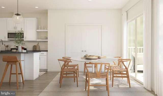 a view of a kitchen with dining area a sink and a window