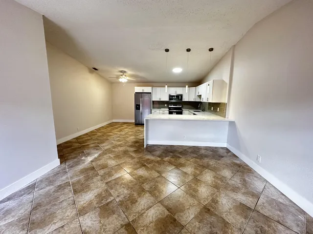 a view of a kitchen with a sink